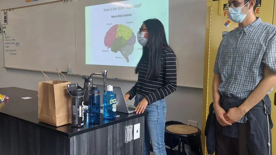 Members of the Zeiger Lab give a presentation on careers in neuroscience at East College Prep.