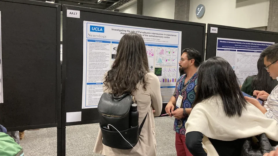 Dr. Baruc Campos presenting his findings at a poster at the SfN 2023 Annual Meeting