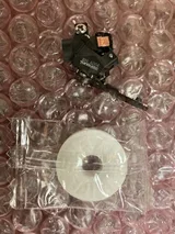 A miniaturized two-photon microscope next to a lifesaver candy