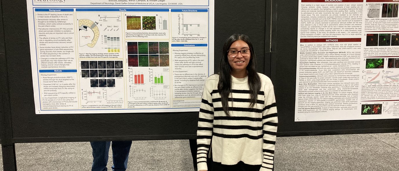 Ms. Brenda Vasquez posing in front of her poster at the SfN 2023 Annual Meeting